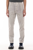 Person wearing light gray pants on a white background