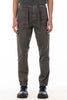 Person wearing dark grey cargo pants on a white background