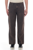 Black carpenter pants worn by a person on a white background