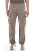 Beige cargo pants worn by a person on a white background