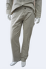 person wearing bone color carpenter pants against a white background