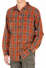 Orange and brown plaid shirt worn by a person on a white background