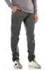 Person wearing gray cargo pants and sneakers on a white background
