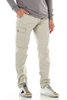 Person wearing beige cargo pants on a white background