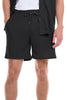 Person wearing black checkered shorts with a white background