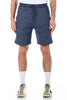 Person wearing blue shorts on a white background