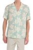 Man wearing a light blue floral patterned shirt on a white background