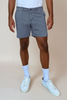 slate color shorts on model with tan background