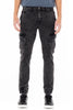 Person wearing black cargo pants on a white background